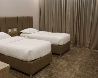 Qimam Park Hotel 3 - Abha - Schlafzimmer