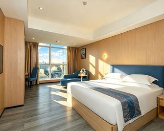 Green Island Holiday Hotel - Jiang Men - Спальня
