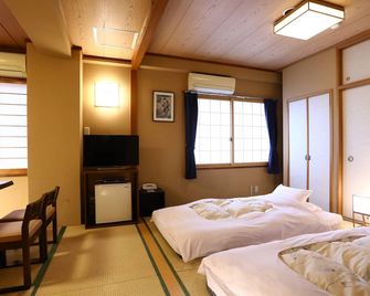 Ryokan Kamogawa Asakusa - Tokio - Schlafzimmer