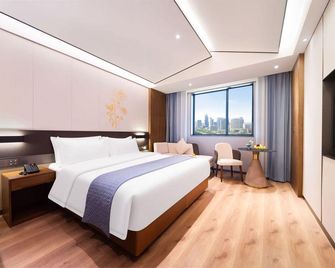 Songchao Kaifeng Hotel (Kaifeng Drum Tower Square Millennium City Park Yingbin Gate) - Kaifeng - Спальня