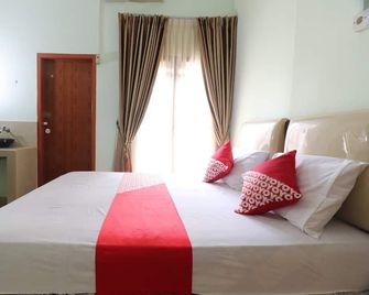 Hotel O Excellent Kost - Jambi - Schlafzimmer