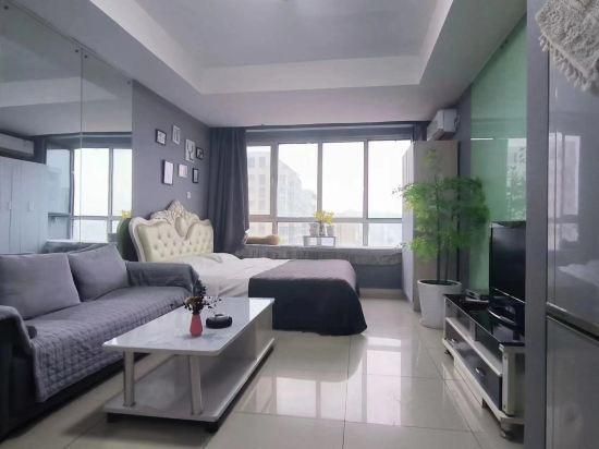 Qingdao Lanting Holiday Apartment - تشينغداو - غرفة نوم