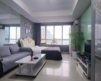 Qingdao Lanting Holiday Apartment - تشينغداو - غرفة نوم