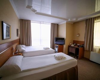 سيتي هوتل بيشكيك - بيشكيك - غرفة نوم