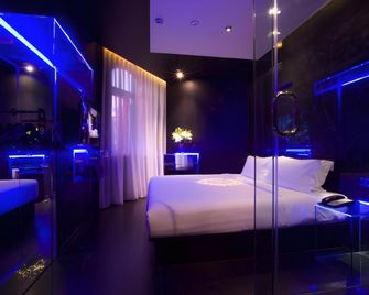 Orange Hotel Qingdao Haier Road Shilaoren Bathing Beach - تشينغداو - غرفة نوم