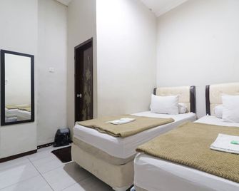 Hotel Omah Ampel Syariah - Surabaya - Schlafzimmer