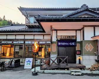 A traditional Japanese house with a storyteller of / Tono Iwate - Tōno - Edificio
