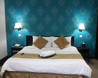 Carlton Holiday Hotel & Suites - Shah Alam - Schlafzimmer