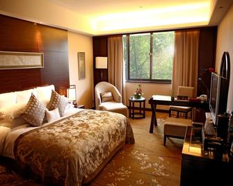 سوتشو جاردن هوتل - سوزهو - غرفة نوم