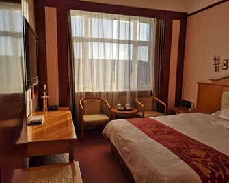 Xing Rong Business Hotel - Daqing - Habitación