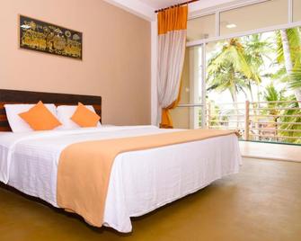 OYO 490 Shangrela Beach Resort - Ambalangoda - Habitación