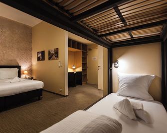 هوتل أوريون - غينت - غرفة نوم