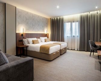 ميركيور ريو باداجوز - بطليوس - غرفة نوم