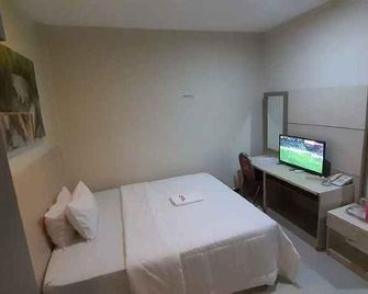 Galaxy Inn - Baubau - Habitación