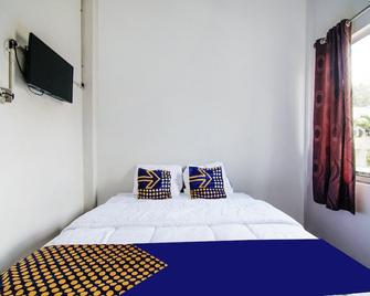 Spot On 91598 Oklahoma Homestay Syariah - Pekanbaru - Schlafzimmer