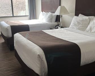 Cobblestone Inn & Suites - Denison | Oak Ridge - Denison - Schlafzimmer