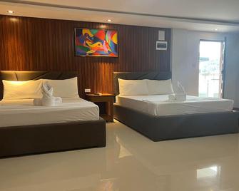 RedDoorz Premium @ Orient De Galera Beach Resort - Puerto Galera - Schlafzimmer
