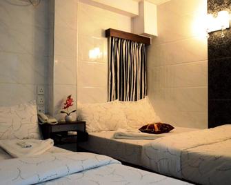 Kowloon Tst Guest House - Hong Kong - Habitación