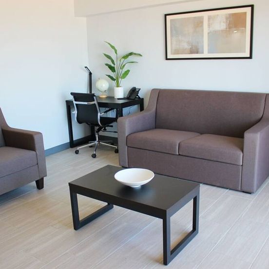 Living room view of Sun & Sand Resort Oceanfront Suites