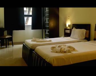 All Seasons Guest House - Margao - Schlafzimmer