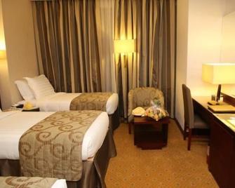 Al Rawda Al Aqeeq Hotel - Medina - Phòng ngủ