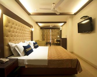 Metropolis Tourist Home - New Delhi - Bedroom