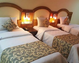 Hotel City Centaur - Bengaluru - Bedroom