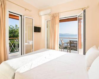 Brentanos Apartments - A - View of Paradise - Gastouri - Bedroom