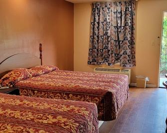 Western Inn - Union City - Schlafzimmer