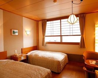 Hida Tomoe Hotel - Hida - Bedroom