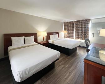 Days Inn by Wyndham Raleigh South - Raleigh - Bedroom