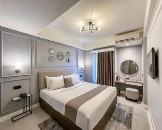 Hotel Fortunagrande Malioboro Yogyakarta - Yogyakarta - Schlafzimmer