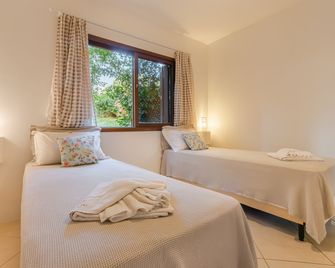 Pousada Areias do Rosa - Praia do Rosa - חדר שינה