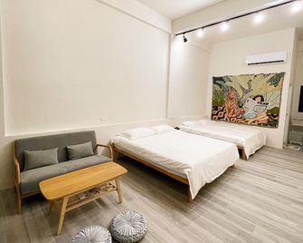 Ocean Waves Villa - Qimei Seaside Homestay - Qimei - Schlafzimmer