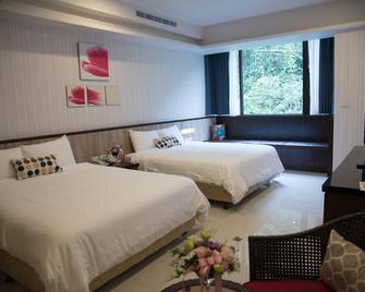 Issmy Hotel Spring Resort - Jiaoxi - Schlafzimmer