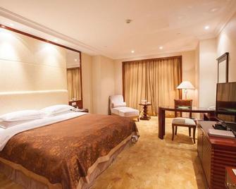 Dongying Dongsheng Hotel - Dongying - Bedroom