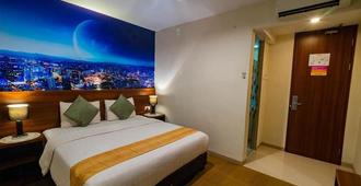 Miyana Hotel - Medan - Camera da letto