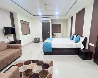 Hotel Bramha Inn - Pune - Schlafzimmer