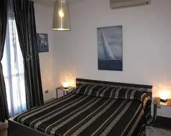 ماجرالو بد آند بريكفاست - الغيرو - غرفة نوم