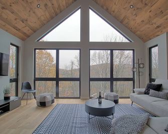 Chalet in the mountains, on the golf course and near skiing. - Saint-Faustin-Lac-Carré - Huiskamer