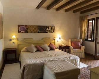 Is Benas Country Lodge - Santa Caterina - Спальня