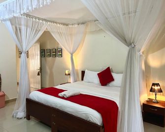 Sunset Hotel Entebbe - Ентеббе - Спальня