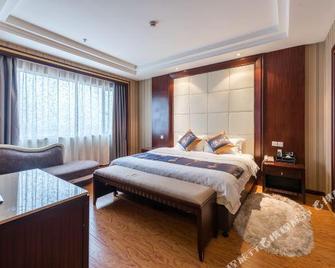 Shengxiao Ginlan Jia Grand Hotel (Quzhou Airport) - Quzhou - Habitación