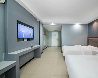 Guangzhou Junyi · Residence Hotel (Guangzhou South Railway Station Panyu Chimelong) - גואנגג'ואו - חדר שינה