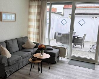 Wohlfühloase Huus Süüdstraat-Modern, komfortabel mit großzügiger Sonnen-Terrasse - Norderney - Huiskamer