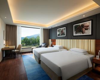 حيات ريجينسي ديرادون ريزورت آند سبا - دهرادون - غرفة نوم