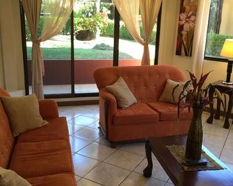 Ground floor of beautiful new home with pool Available by day(s)week or month - Golfito - Living room