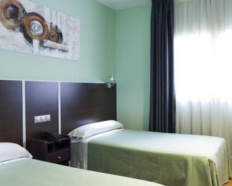 Hostal Avenida Barajas - מדריד - חדר שינה