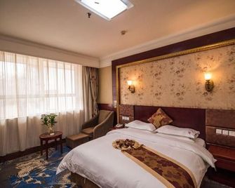 Xinxiang Jiuzhou Hotel (Pangdonglai Erpang) - Xinxiang - Bedroom