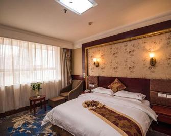 Xinxiang Jiuzhou Hotel (Railway Station Pangdonglai Plaza) - Xinxiang - Bedroom